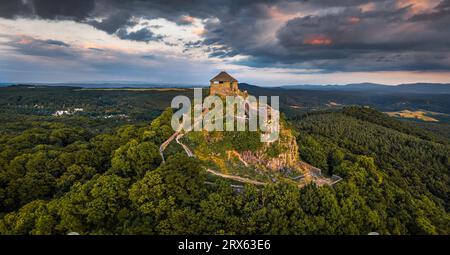 Salgotarjan, Hungary - Aerial panoramic view of Salgo Castle (Salgo vara) in Nograd county with dark clouds above at sunset on a sunny summer afternoo Stock Photo