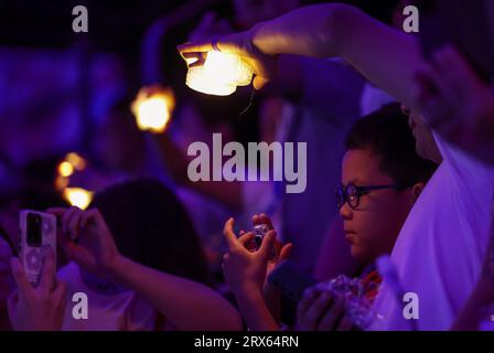 Beijing, China's Zhejiang Province. 23rd Sep, 2023. Audience take photos before the opening ceremony of the 19th Asian Games at the Hangzhou Olympic Sports Center Stadium in Hangzhou, east China's Zhejiang Province, Sept. 23, 2023. Credit: Pan Yulong/Xinhua/Alamy Live News Stock Photo