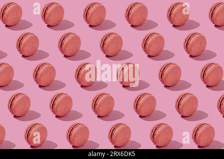 Background of crunchy macaroons on pink background Stock Photo