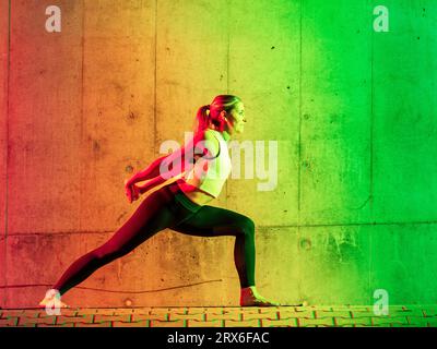 Active woman in sportswear practicing yoga Stock Photo