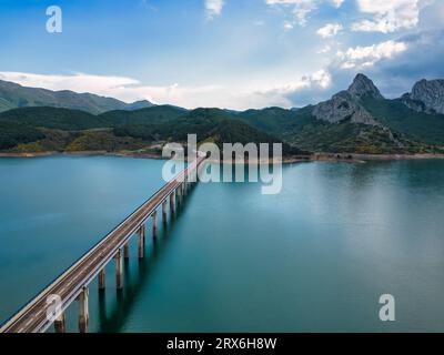 Spain, Asturias, Riano, Aerial view of bridge stretching over Embalse de Riano reservoir Stock Photo