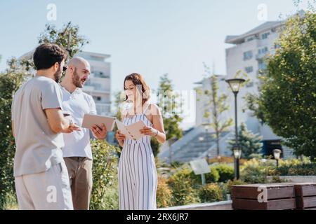 Successful Architects Collaborating on Modern Urban Construction Project Stock Photo