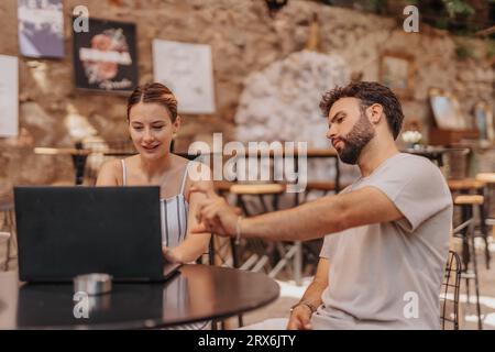 Creative Business Professionals Strategizing over Coffee Stock Photo