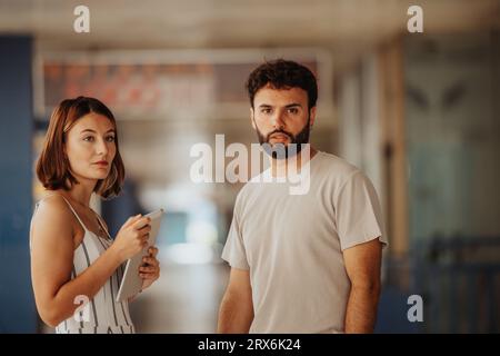 Intense outdoor meetings with confident businesspeople analyzing stats, discussing project development, and strategizing for successful outcomes. Stock Photo