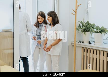 Disappointed female doctors reading negative results. Stock Photo