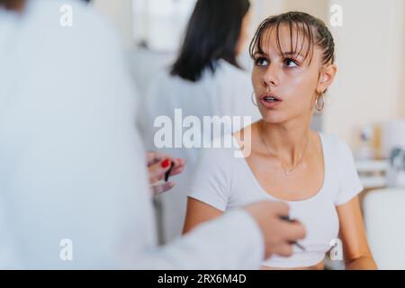 Medical Professionals Conducting Thorough Health Assessments with Specialized Tools Stock Photo