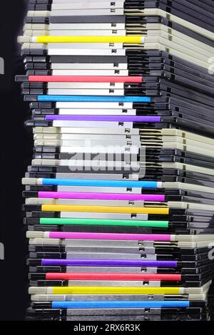 Pile of vintage floppy disks in multi-colored theme technology ...