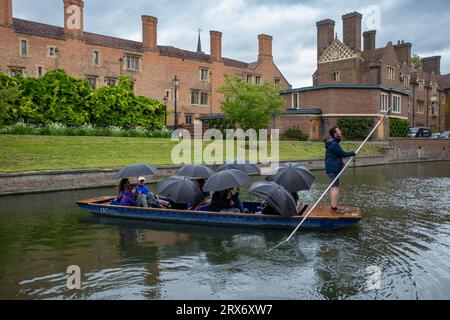 Picture dated September 20th shows people in the high winds and rain in Cambridge whilst they go for a punt on the River Cam on Wednesday afternoon. Stock Photo