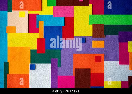 Colorful texture created with pieces of felt fabric of different colors in square and rectangular shapes Stock Photo