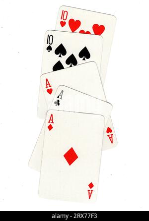 A hand of vintage poker playing cards featuring a full house of aces and tens. Stock Photo