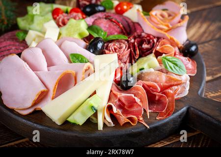 Colorful charcuterie boards and boxes vegetables, meat and cheese.  Assortment of tasty appetizers or antipasti. Stock Photo
