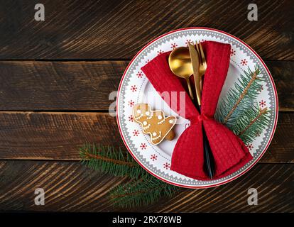 Christmas table setting for celebration design. Holiday celebration.  Kitchen dining table. Winter holiday season. Food decor. Top view, flat lay Stock Photo