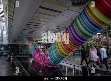 Canary Wharf, London, UK: Beneath the Adams Place footbridge connecting Canary Wharf Elizabeth Line station to One Canada Square in London Docklands. Stock Photo