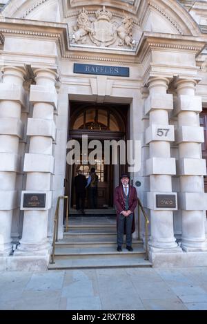 Whitehall, Westminster, London, UK. 23rd Sep, 2023. The Raffles hotel that has been redeveloped from the Old War Office building in Whitehall is due to open on 29th September. A doorman is on hand to discuss the upcoming opening. Part of the building is residential Stock Photo