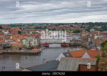 Whitby,England,9,August,2023.View from West Cliff, over the buildings with the swing bridge and harbour in the background Stock Photo