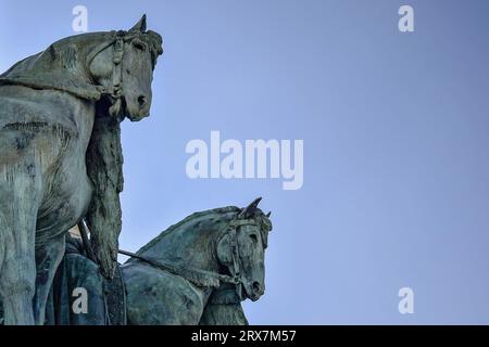 Fragment of the Millennium Monument on the Heroes' Square in Budapest, Hungary. Side view on statue horses of  the chieftains of the Magyars against a Stock Photo