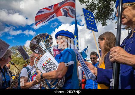 London, UK. 23 Sep 2023: A woman in a blue beret plays the tuba, a brass instrument, at the EU National Rejoin March in central London. Thousands of people marched across the city in support of the UK rejoining the European Union. Credit: Andy Soloman/Alamy Live News Stock Photo