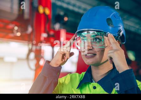 Engineer women using visual VR glasses innovation in advance engineering technology industry working support device Stock Photo