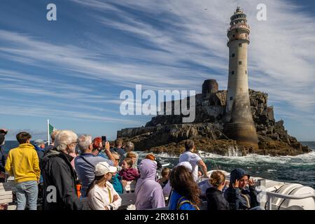 Cape Clear ferry 'Carraig Aonair' at the Fastnet Lighthouse or 'Ireland's Teardrop', West Cork, Ireland. Stock Photo