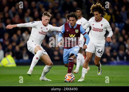 Burnley's Luca Koleosho (centre), Manchester United's Scott McTominay (left) and Manchester United's Hannibal Mejbri battle for the ball during the Premier League match at Turf Moor, Burnley. Picture date: Saturday September 23, 2023. Stock Photo