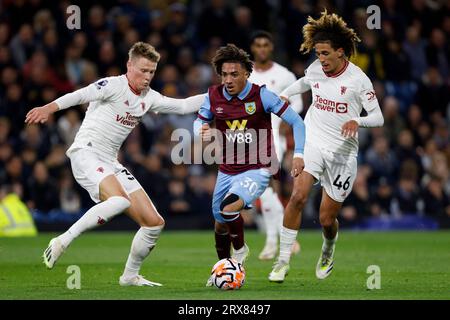 Burnley's Luca Koleosho (centre), Manchester United's Scott McTominay (left) and Manchester United's Hannibal Mejbri battle for the ball during the Premier League match at Turf Moor, Burnley. Picture date: Saturday September 23, 2023. Stock Photo