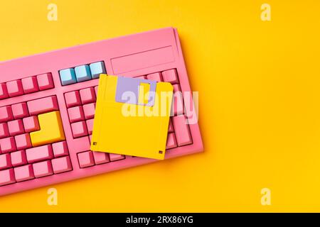Floppy disks and keyboard on bright colored backgrounds. High quality photo Stock Photo