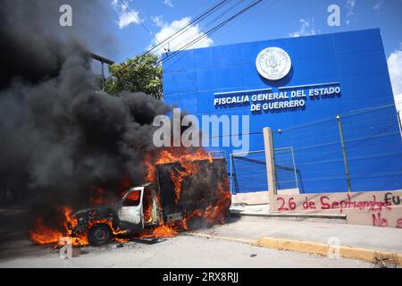 Chilpancingo, Mexico. 23rd Sep, 2023. A van set on fire by students of the Raul Isidro Burgos de Ayotzinapa rural school stands before the Attorney General's Office of the State of Guerrero. Corrupt police officers had abducted 43 students from the Ayotzinapa Teachers' Seminary in the southern city of Iguala on the night of September 27, 2014, and handed them over to the Guerreros Unidos crime syndicate. The background to the crime has not yet been fully clarified. Credit: Jesús Ramírez/dpa/Alamy Live News Stock Photo