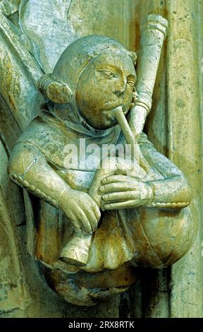 Beverley Minster, carved stone musician, bagpipes, Medieval carving, Yorkshire, England Stock Photo
