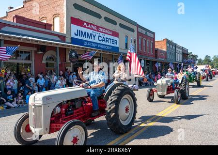 Plains, United States. 23rd Sep, 2023. Antique farm tractors process down Main Street during the 26th annual Plains Peanut Festival in honor of former President Jimmy Carter, September 23, 2023 in Plains, Georgia. Former President Jimmy Carter and his wife Rosalynn Carter, life-long residents of the village were briefly spotted at the festival inside a private vehicle. Credit: Richard Ellis/Richard Ellis/Alamy Live News Stock Photo