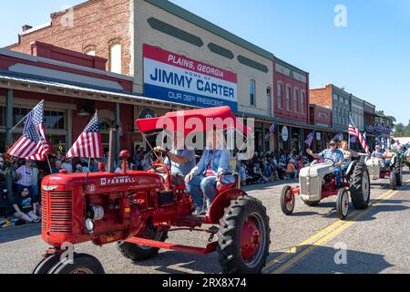 Plains, United States. 23rd Sep, 2023. Antique farm tractors process down Main Street during the 26th annual Plains Peanut Festival in honor of former President Jimmy Carter, September 23, 2023 in Plains, Georgia. Former President Jimmy Carter and his wife Rosalynn Carter, life-long residents of the village were briefly spotted at the festival inside a private vehicle. Credit: Richard Ellis/Richard Ellis/Alamy Live News Stock Photo