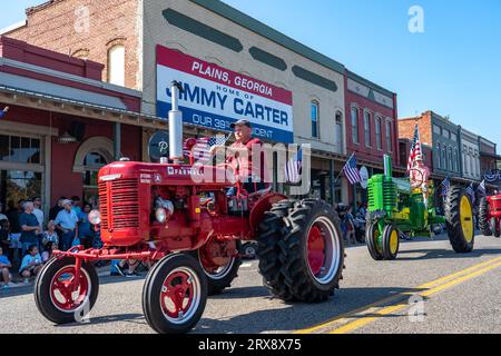 Plains, United States. 23rd Sep, 2023. Antique farm tractors process down Main Street during the 26th annual Plains Peanut Festival in honor of former President Jimmy Carter, September 23, 2023 in Plains, Georgia. Former President Jimmy Carter and his wife Rosalynn Carter, life-long residents of the village were briefly spotted at the festival inside a private vehicle. Credit: Richard Ellis/Richard Ellis/Alamy Live News Stock Photo