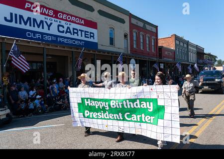 Plains, United States. 23rd Sep, 2023. National Park Rangers hold a sign celebrating the 99th birthday of former President Jimmy Carter as they march at the 26th annual Plains Peanut Festival, September 23, 2023 in Plains, Georgia. Former President Jimmy Carter and his wife Rosalynn Carter were briefly spotted at the festival inside a private vehicle. Credit: Richard Ellis/Richard Ellis/Alamy Live News Stock Photo