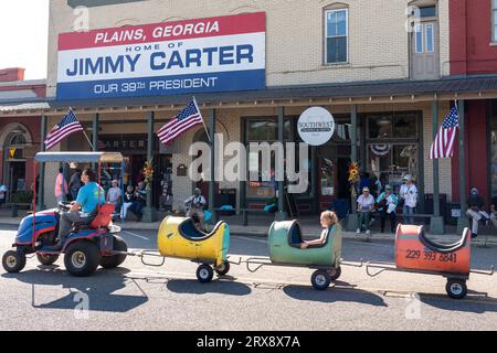 Plains, United States. 23rd Sep, 2023. A children's train made from barrels passes down Maine Street at the 26th annual Plains Peanut Festival in honor of former President Jimmy Carter, September 23, 2023 in Plains, Georgia. Former President Jimmy Carter and his wife Rosalynn Carter were briefly spotted at the festival inside a private vehicle. Credit: Richard Ellis/Richard Ellis/Alamy Live News Stock Photo