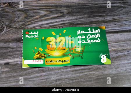 Cairo, Egypt, September 11 2023: Panda supermarket 32nd anniversary coupon for an opportunity of winning one of 32 gold bars and free trolly, the annu Stock Photo