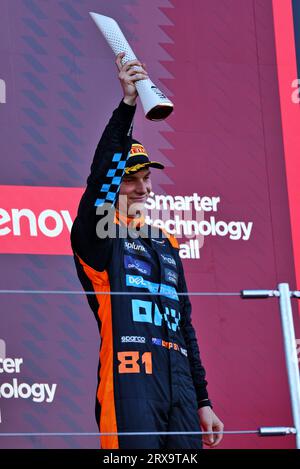 Oscar Piastri of McLaren celebrates on the podium second place after ...