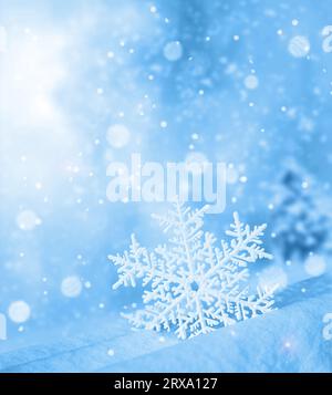 Snowflake shaped bokeh. Combined with blue background. Christmas concept. Stock Photo
