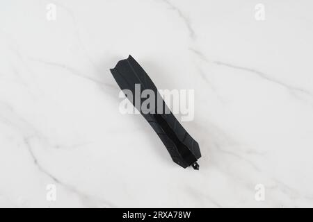 Switchblade (automatic) out-the-front (OTF)pocket knife in folded position. Pocket penknife with retractable blade. Stock Photo