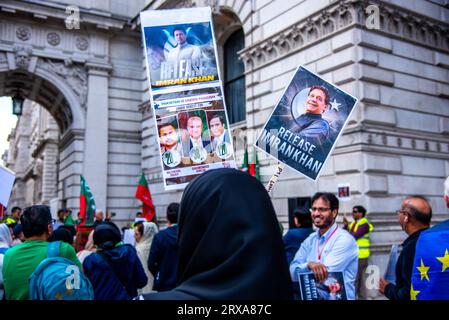 London, UK. 23rd Sep, 2023. Protestors hold placards and flags during the Imran Khan Supporters Protest Demonstrators in London gathered outside the Foreign Office over the arrest of former Pakistani prime minister Imran Khan.Pakistan's former prime minister Imran Khan was arrested after a court in Islamabad sentenced him to three years in jail and disqualified him from politics for “corrupt practices” involving the sale of state gifts. Credit: SOPA Images Limited/Alamy Live News Stock Photo