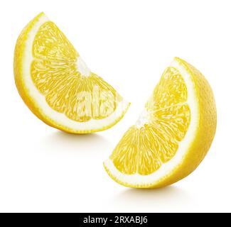 Ripe slices of yellow lemon citrus fruit stand isolated on white background with clipping path Stock Photo