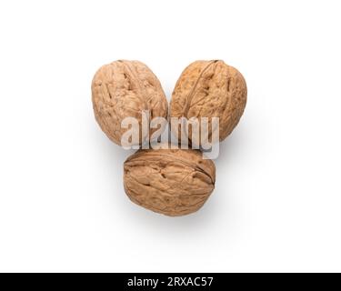 Three walnuts top view on white background, from above Stock Photo