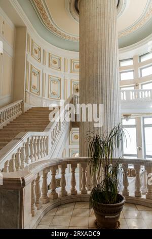 Beautiful ornate white marble staircase inside the Palace of the Parliament, House of the Republic, Bucharest, Romania Stock Photo