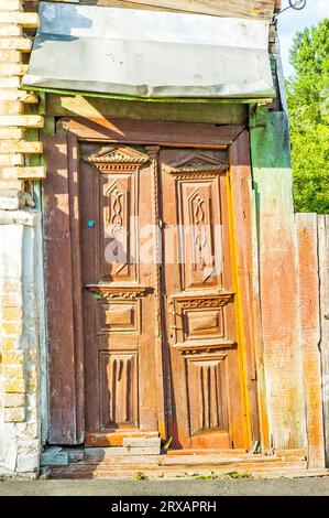 Old typical wooden ukrainian door in Kiev Stock Photo