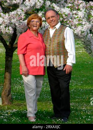 Older married couple in park, posing, portrait, friendly, smiling, Older married couple, posing, portrait, friendly, smiling Stock Photo