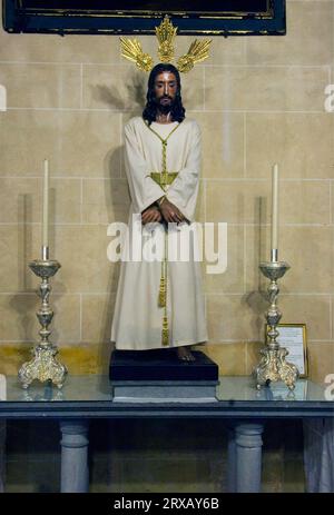 Basilica of Santa Maria de la Asuncion, altar with Christ statue, Arcos de la Frontera, white villages, Pueblos Blancos, Andalusia, Spain, Mudejar Stock Photo