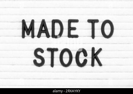 Black color letter in word made to stock on white felt board background Stock Photo