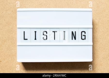 Lightbox with word listing on wood background Stock Photo