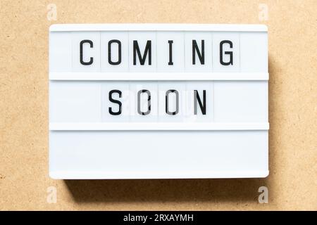 Lightbox with word coming soon on wood background Stock Photo