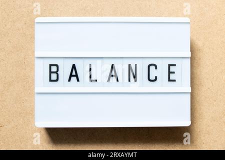 Lightbox with word balance on wood background Stock Photo