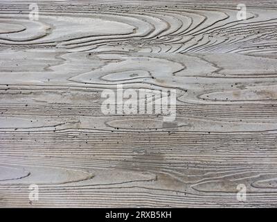 Close-up of a concrete wall with visible wooden structure Stock Photo