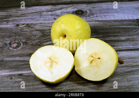 Fresh pears fruits, The pear tree and shrub are a species of genus Pyrus, in the family Rosaceae, bearing the pomaceous fruit of the same name, Severa Stock Photo